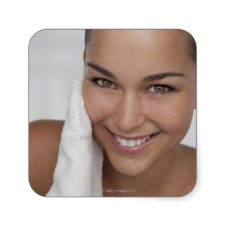 Woman scrubbing her face with cloth sticker