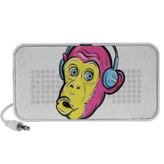 curious monkey in headphones travelling speaker