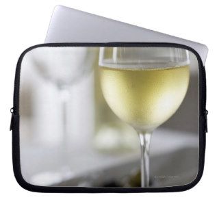 A glass of white wine 2 laptop computer sleeves