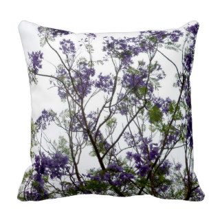 purple green flowers against bright sky floral pillows