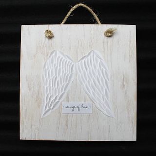 angel wings artwork on wood by lindsay interiors