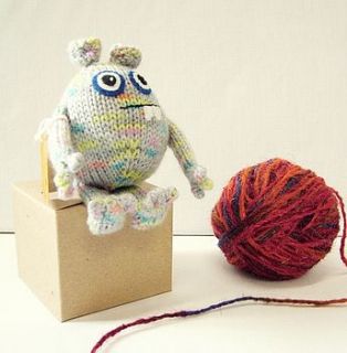knitted gift monster by the gift box