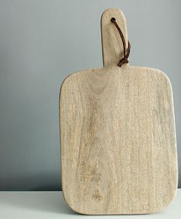 hand crafted mango wood chopping board by knead home