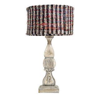 carved wood table lamp with striped shade by out there interiors