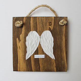 angel wings on wood artwork by lindsay interiors