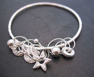 silver charm bangle by lucy kemp jewellery
