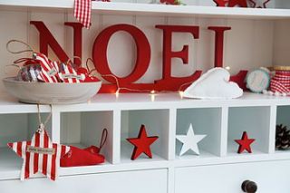 christmas noel wooden letters by the cotton tree