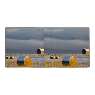 Rustic barn and hay bales after a fresh snow 3 binder