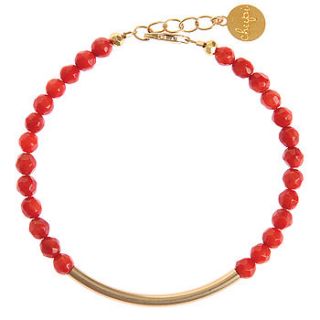 the gold bar bracelet in coral by chupi