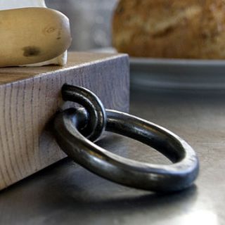 oak chopping board with iron ring by alex pole ironwork