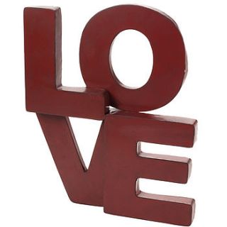 large metal love sign by the contemporary home