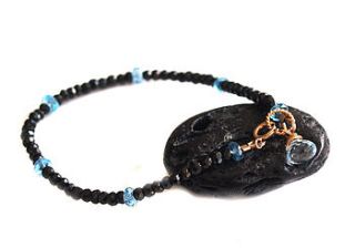 spinel and blue topaz charm bracelet by prisha jewels