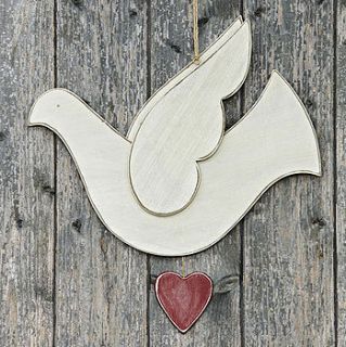 large dove with heart by boxwood