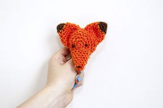 crocheted orange fox brooch by fox bunting