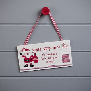 personalised santa stop here sign by the contemporary home