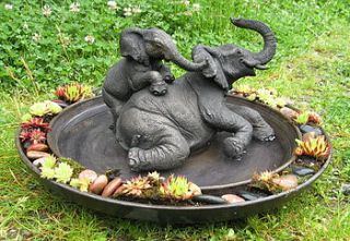 elephant wallow in pond by suzie marsh sculpture