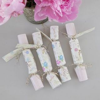 floral and swallow place setting crackers by lilac coast weddings