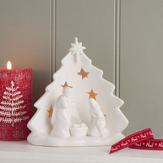 white ceramic nativity scene tea light holder by the contemporary home