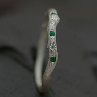 eternity ring set with emerald and diamond by anthony blakeney