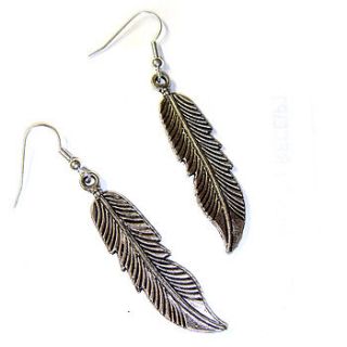 large silver toned feather earrings by hannah makes things