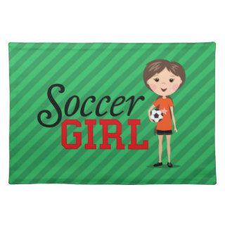 Cute cartoon soccer girl holding a ball on green placemats