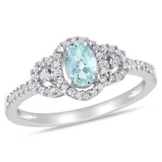Oval Aquamarine and 1/6 CT. T.W. Diamond Buckle Ring in Sterling