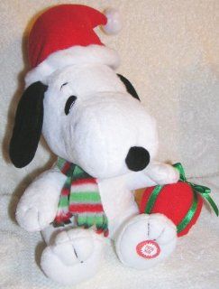 Peanuts Animated Musical Christmas Snoopy Doll with Santa Hat and Red Present Toys & Games