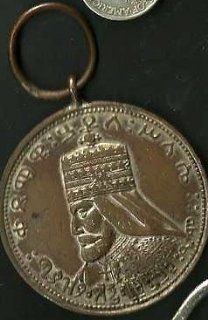 The Coronation Medal of Emperor Haile Selassie I, issued to celebrate the 1930 accession of the Emperor to the Throne. This silver medal features a profile of the Emperor, in coronation attire and Imperial Crown, facing to the left. The inscription around 