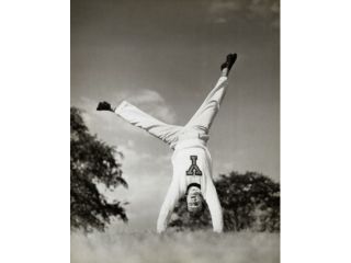 Male cheerleader doing a cartwheel Poster Print (18 x 24)